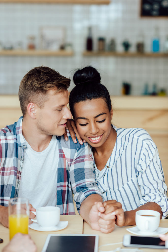 woman smiling with her boyfriend after getting her teeth whitened in tampa, FL